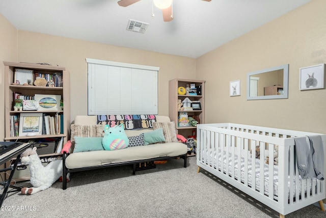 bedroom featuring a ceiling fan, visible vents, and carpet