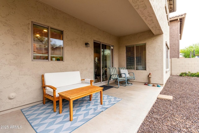 view of patio / terrace featuring fence
