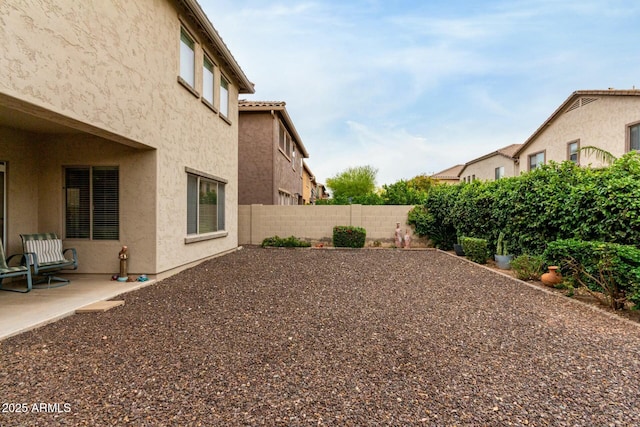 view of yard with a fenced backyard and a patio area
