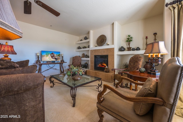 19700 N 76th St Unit 2001, Scottsdale, AZ 85255 - living room with lofted ceiling, carpet, built in shelves, a ceiling fan, and a fireplace