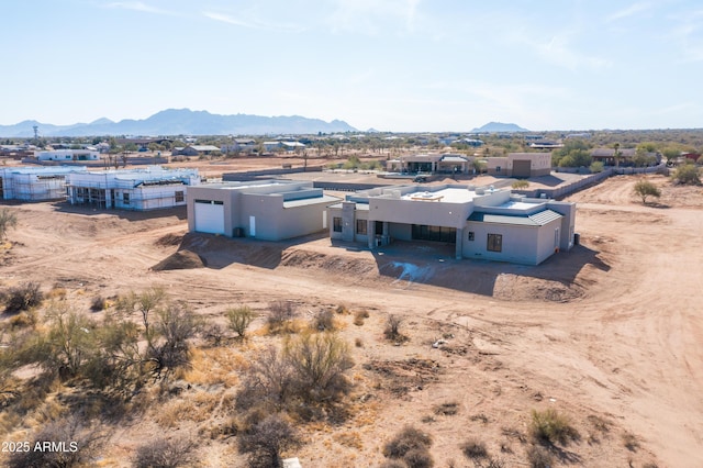 birds eye view of property with a mountain view