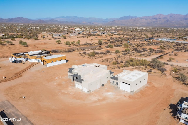 aerial view featuring a desert view and a mountain view