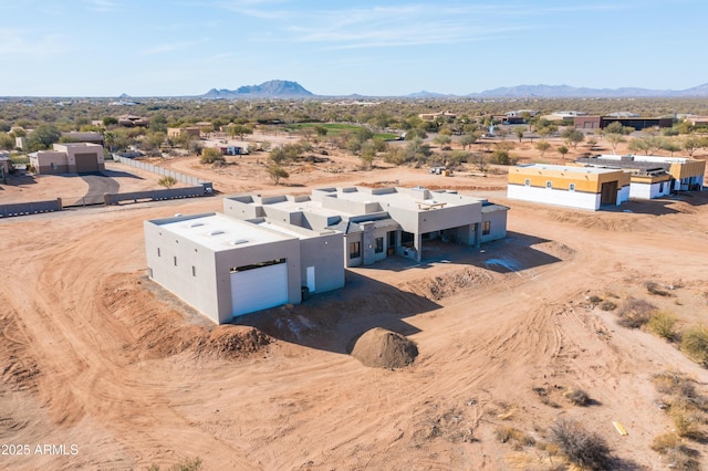 aerial view with a mountain view and view of desert