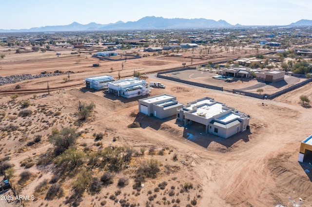 birds eye view of property featuring a desert view and a mountain view