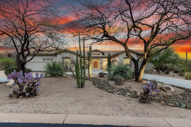 view of front of home featuring stucco siding