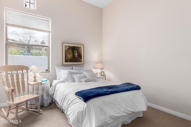 bedroom featuring carpet flooring and baseboards