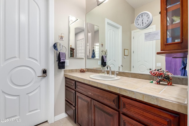 bathroom with tile patterned floors and vanity