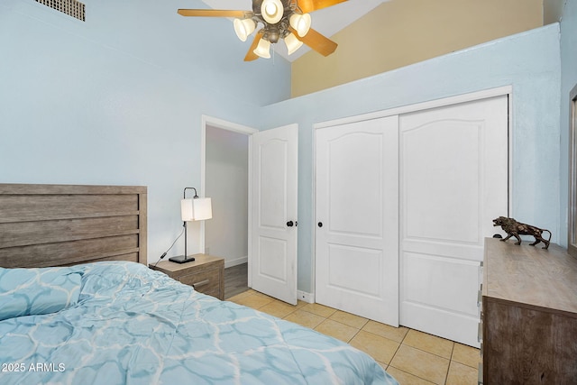 10226 W Country Club Trl, Peoria, AZ 85383 - bedroom featuring light tile patterned floors, high vaulted ceiling, a ceiling fan, and a closet