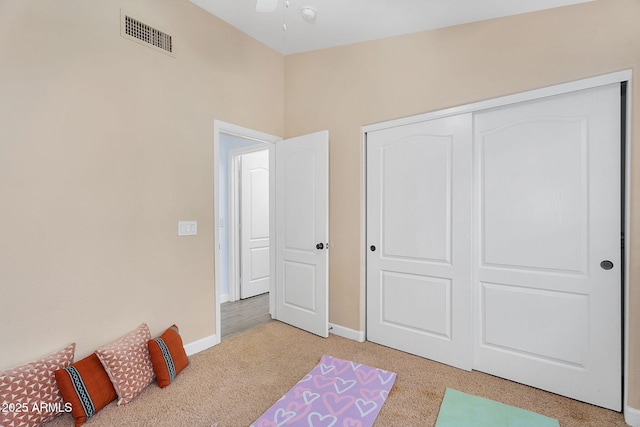 10226 W Country Club Trl, Peoria, AZ 85383 - bedroom featuring light carpet, a closet, and baseboards