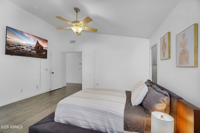 10226 W Country Club Trl, Peoria, AZ 85383 - bedroom featuring wood finished floors, lofted ceiling, and a ceiling fan