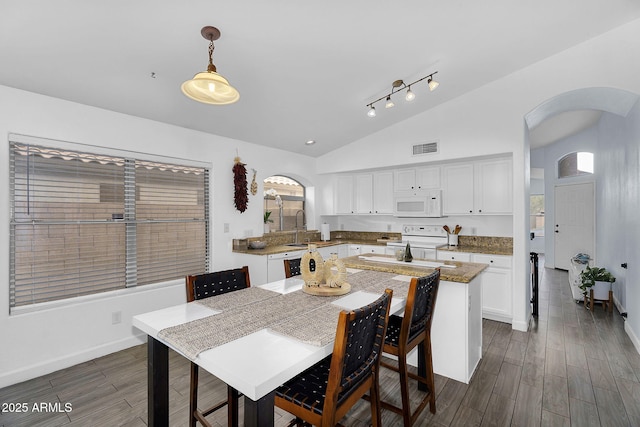 10226 W Country Club Trl, Peoria, AZ 85383 - kitchen featuring white appliances, arched walkways, vaulted ceiling, white cabinetry, and dark wood finished floors