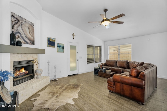 10226 W Country Club Trl, Peoria, AZ 85383 - living area with ceiling fan, lofted ceiling, baseboards, a stone fireplace, and wood finished floors