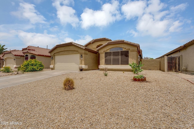10226 W Country Club Trl, Peoria, AZ 85383 - mediterranean / spanish-style home featuring stucco siding, an attached garage, driveway, and a tiled roof
