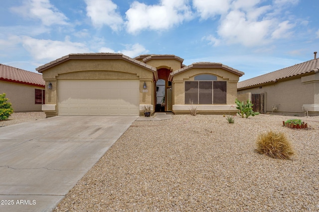 10226 W Country Club Trl, Peoria, AZ 85383 - mediterranean / spanish-style home featuring concrete driveway, an attached garage, stucco siding, and a tile roof
