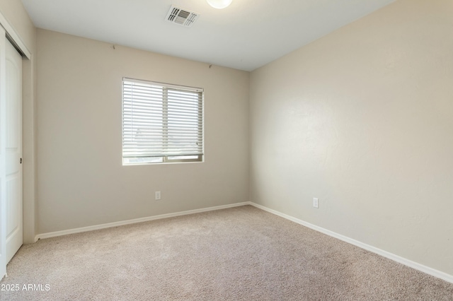 unfurnished room featuring carpet