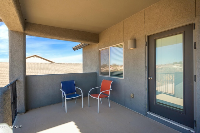 view of patio featuring a balcony