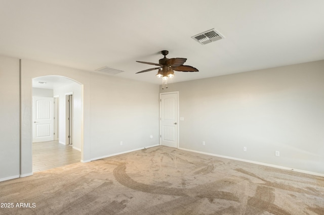 unfurnished room with ceiling fan and light colored carpet