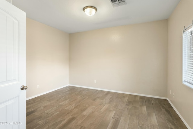 empty room with wood-type flooring