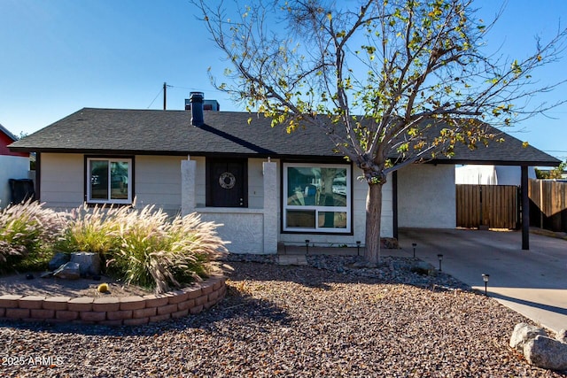 ranch-style home with a carport