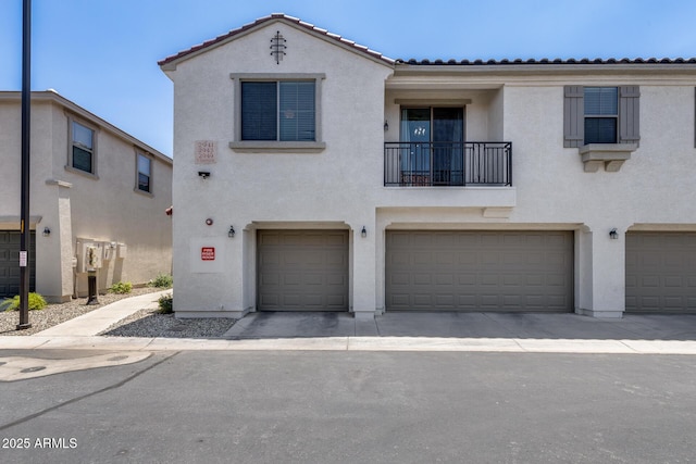 2941 E Darrow St, Phoenix, AZ 85042 - view of front of home with stucco siding, a garage, and a tile roof