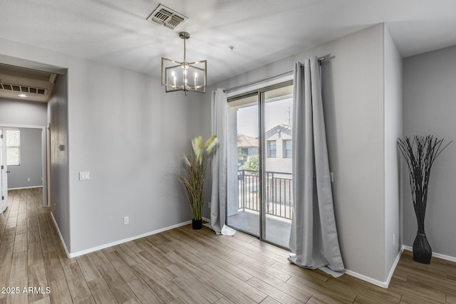 2941 E Darrow St, Phoenix, AZ 85042 - unfurnished dining area with wood finished floors and a chandelier