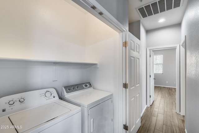 2941 E Darrow St, Phoenix, AZ 85042 - laundry area with separate washer and dryer and wood finished floors