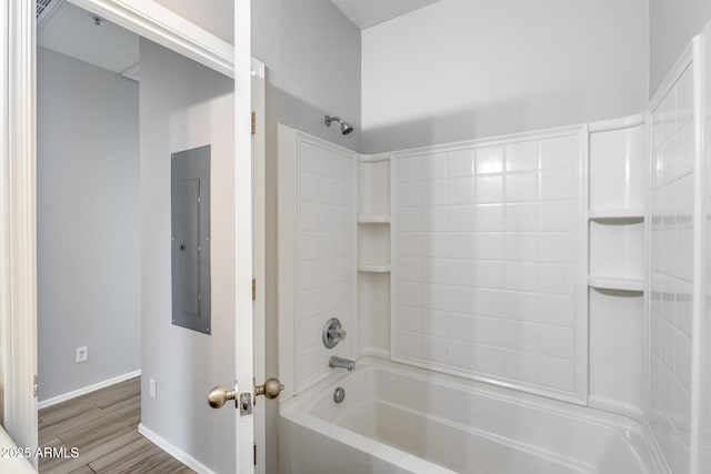 2941 E Darrow St, Phoenix, AZ 85042 - bathroom featuring electric panel, bathtub / shower combination, and wood finished floors