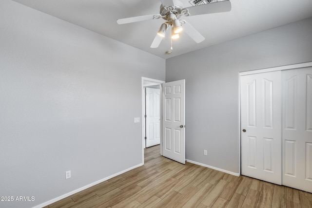 2941 E Darrow St, Phoenix, AZ 85042 - unfurnished bedroom with light wood-style flooring, a closet, and a ceiling fan