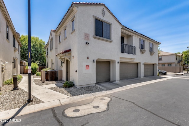 2941 E Darrow St, Phoenix, AZ 85042 - view of front of property with stucco siding, a garage, a tile roof, and driveway