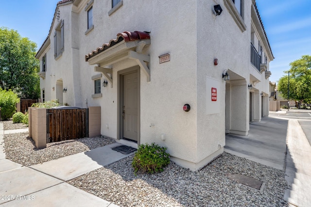 2941 E Darrow St, Phoenix, AZ 85042 - view of property exterior featuring stucco siding and a tile roof