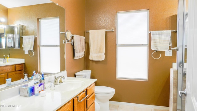 10952 S Desert Lake Dr, Goodyear, AZ 85338 - full bathroom featuring vanity, a shower with door, a textured wall, toilet, and tile patterned floors