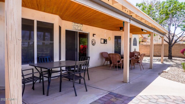 10952 S Desert Lake Dr, Goodyear, AZ 85338 - view of patio / terrace with fence and outdoor dining space