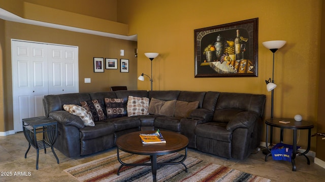10952 S Desert Lake Dr, Goodyear, AZ 85338 - living room featuring baseboards and tile patterned flooring