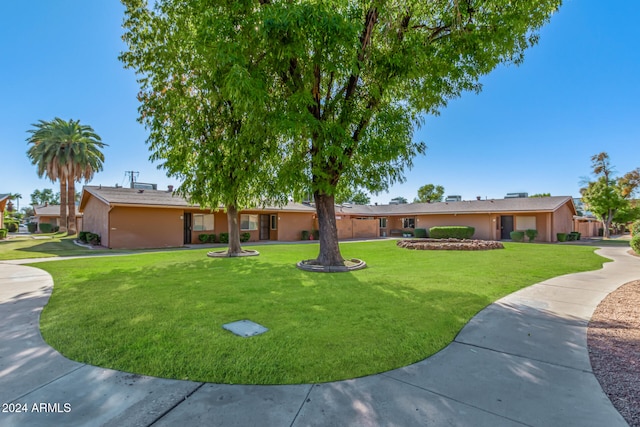 surrounding community featuring a lawn