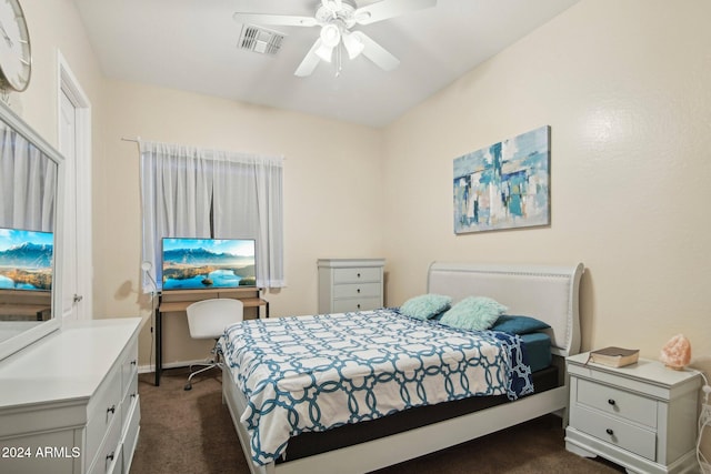 bedroom with dark colored carpet and ceiling fan