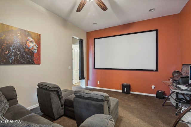 home theater room featuring carpet and ceiling fan