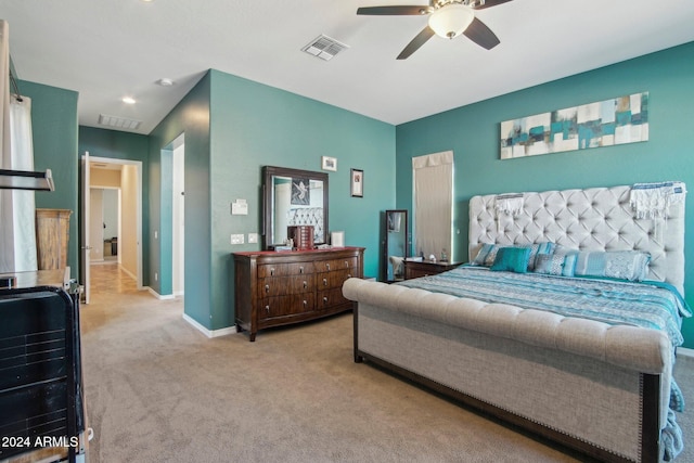 bedroom with light colored carpet and ceiling fan