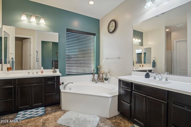 bathroom with vanity and a tub