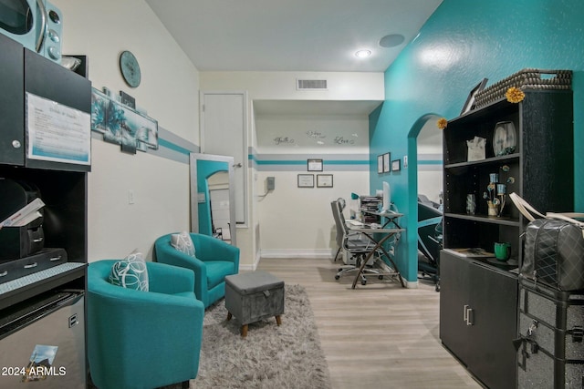 home office with wood-type flooring