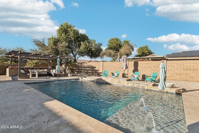 view of swimming pool featuring pool water feature, a pergola, and a patio