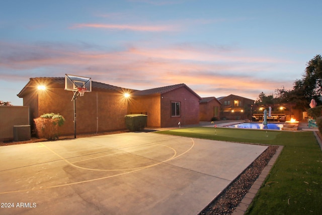 view of sport court featuring a fenced in pool