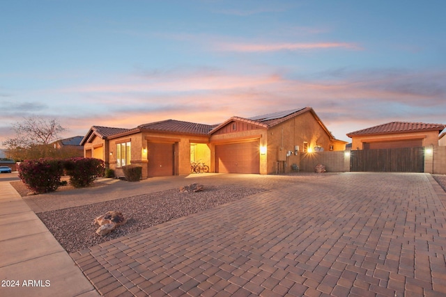 view of front of property with a garage