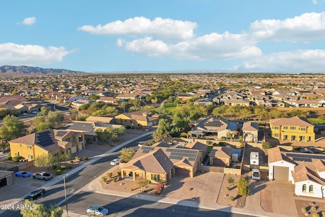 birds eye view of property with a mountain view