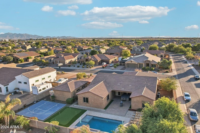 birds eye view of property featuring a mountain view