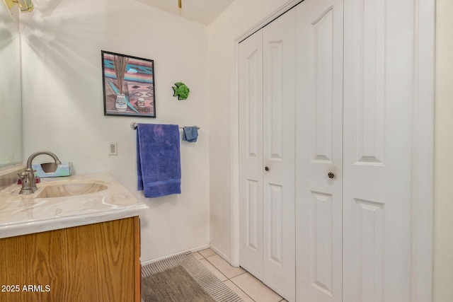 619 E Elaine St, Casa Grande, AZ 85122 - bathroom featuring a closet, baseboards, tile patterned flooring, and vanity