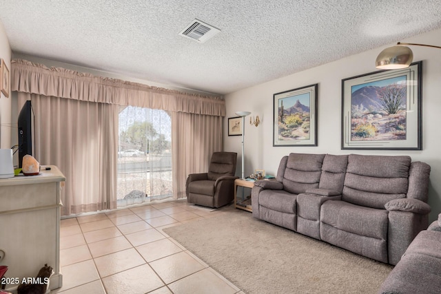 619 E Elaine St, Casa Grande, AZ 85122 - living room with visible vents, a textured ceiling, and light tile patterned floors