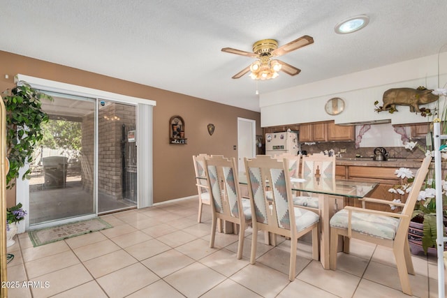 619 E Elaine St, Casa Grande, AZ 85122 - dining room with baseboards, a ceiling fan, a textured ceiling, and light tile patterned flooring
