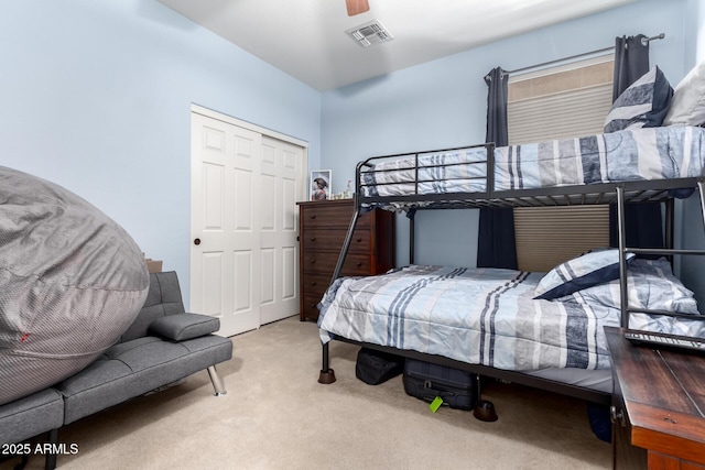 bedroom featuring carpet floors, a closet, and ceiling fan