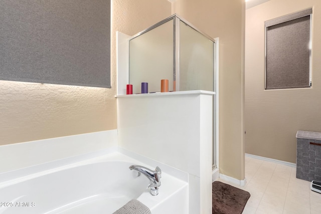 bathroom with separate shower and tub