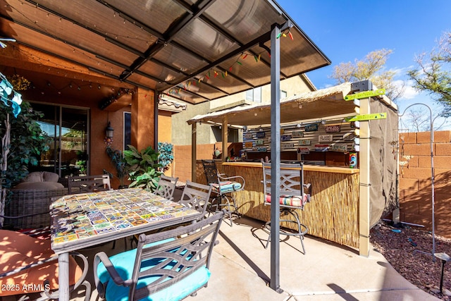 view of patio with a bar